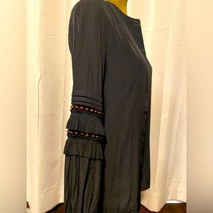 Chico’s black long sleeve blouse with brown beaded sleeves. Size 4.